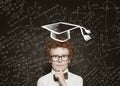 Cute thinking little boy student on science background, vintage retro tonned portrait Royalty Free Stock Photo