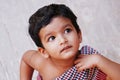 Cute three year old indian baby boy in close up looking