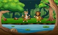 Cute a tiger and lion standing and showing thumbs up by the river