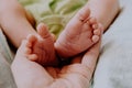 Little feet of newborn baby in mother`s hand. Baby birth, maternity concept. Royalty Free Stock Photo