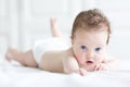 Cute tiny newborn baby enjoying her tummy time Royalty Free Stock Photo