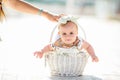 Cute tiny newborn baby princess in a ballet skirt with a bow on a basket with plaid. Soft tones. Adorable newborn infant