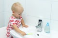 Cute toddler boy brushing teeth. Teeth cleaning, dental care. adorable baby boy washing up