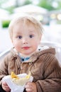 Cute toddler boy eating fastfood Royalty Free Stock Photo