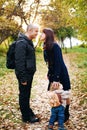 Cute toddler boy hugging his mother`s leg Royalty Free Stock Photo