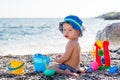 Cute toddler boy playing on the beach Royalty Free Stock Photo