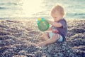 Cute toddler boy playing on the beach Royalty Free Stock Photo