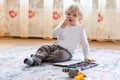 Cute toddler boy of two years eating chocolate Royalty Free Stock Photo