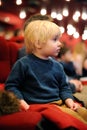 Cute toddler boy watching cartoon movie in the cinema Royalty Free Stock Photo