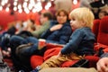 Cute toddler boy watching cartoon movie in the cinema Royalty Free Stock Photo