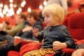 Cute toddler boy watching cartoon movie in the cinema. Leisure/entertainment for kids Royalty Free Stock Photo