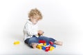 Cute toddler is building with legos