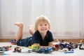 Cute toddler child, blond boy, playing with colofrul plastic blocks, construction toys Royalty Free Stock Photo