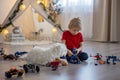 Cute toddler child, blond boy, playing with colofrul plastic blocks, construction toys Royalty Free Stock Photo