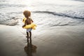 Cute toddler with duck tube on the beach Royalty Free Stock Photo