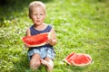 Cute toddler eating a slice of watermelon Royalty Free Stock Photo