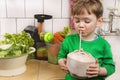 Cute toddler with a fresh coconut