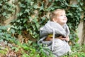 Cute toddler girl in fluffy coat looking on the sky