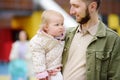 Cute toddler girl having fun on outdoor playground. Young father playing with his little daughter. Spring/summer/autumn active Royalty Free Stock Photo