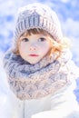Little cute toddler girl outdoors on a sunny winter day. Royalty Free Stock Photo