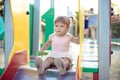 Cute toddler girl playing in sand on outdoor playground. Royalty Free Stock Photo