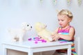 Cute toddler girl playing with toys Royalty Free Stock Photo