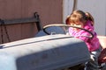 Cute Toddler Girl Playing on Tractor