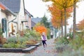 Cute toddler girl running on street in small village Royalty Free Stock Photo