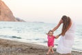 Cute toddler girl walking on a beach Royalty Free Stock Photo