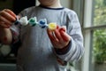 Cute toddler painting with messy hands