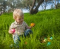 Cute toddler picking eggs