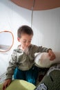 Cute toddler is playing in a kids tent at home Royalty Free Stock Photo