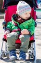 Cute Toddler in pram on a walk Royalty Free Stock Photo
