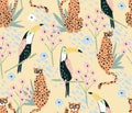 Cute toucan and cheetah seamless pattern. Background with animals, birds and flowers. Royalty Free Stock Photo