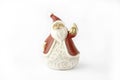 Clay Christmas figure of Santa Claus with golden bell for holiday decorations , Isolated on white background