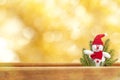 Cute toy snowman on golden background Royalty Free Stock Photo