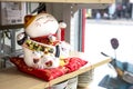 Cute traditional toy mascot beckoning cat