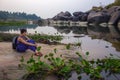 A cute turiska girl is resting on the banks of the Tungabhadra River. Hampi, Karnataka