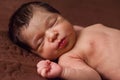 Cute two weeks old newborn baby girl without clothes, or, sleeping