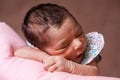 Cute two weeks old newborn baby girl sleeping peacefully Royalty Free Stock Photo