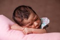 Cute two weeks old newborn baby girl sleeping peacefully Royalty Free Stock Photo