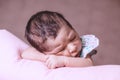 Cute two weeks old newborn baby girl sleeping peacefully Royalty Free Stock Photo