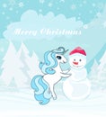 Cute unicorn makes a snowman in the winter Royalty Free Stock Photo