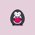 Cute valentine penguin animal character holding a heart shape symbol