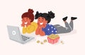 Girls friends watching movie with popcorn, laptop