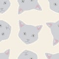 Cute vector pattern with cat head on beige background. Colorful seamless illustration of cartoon animal