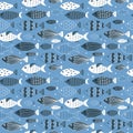 Cute vector seamless pattern with hand drawn fishes in blue tones. childish background Royalty Free Stock Photo