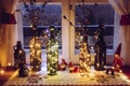 Cute and warm Christmas decoration set with vintage beer bottles and wine bottles filled with micro led party lights.