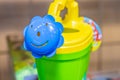 Cute watering can spout element. Background with selective focus and copy space