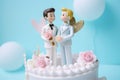 Cute wedding cake topper with two grooms in tuxedos. Gay marriage concept. Royalty Free Stock Photo
